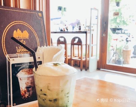 Window mural and drink display at Into the Woods Cafe